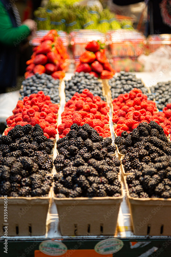 Colorful small berry container at the food market