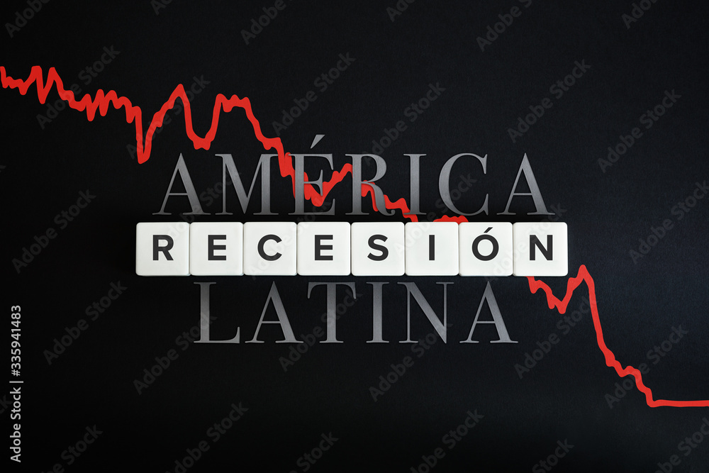 America Latina la recesion economica (Latin America economic recession) caused by coronavirus crisis and covid-19 outbreak. Spanish text and block letters on black background. America Latina la recesion economica (Latin America economic recession) caused by coronavirus crisis and covid-19 outbreak. Spanish text and block letters on black background.
