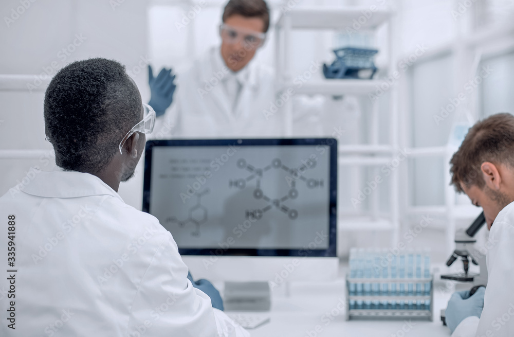 group of scientists working in the laboratory group of scientists working in the laboratory