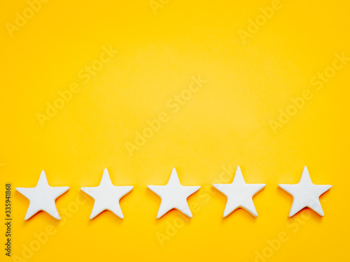 Top position. Leadership success experience. Five white stars on yellow background.
