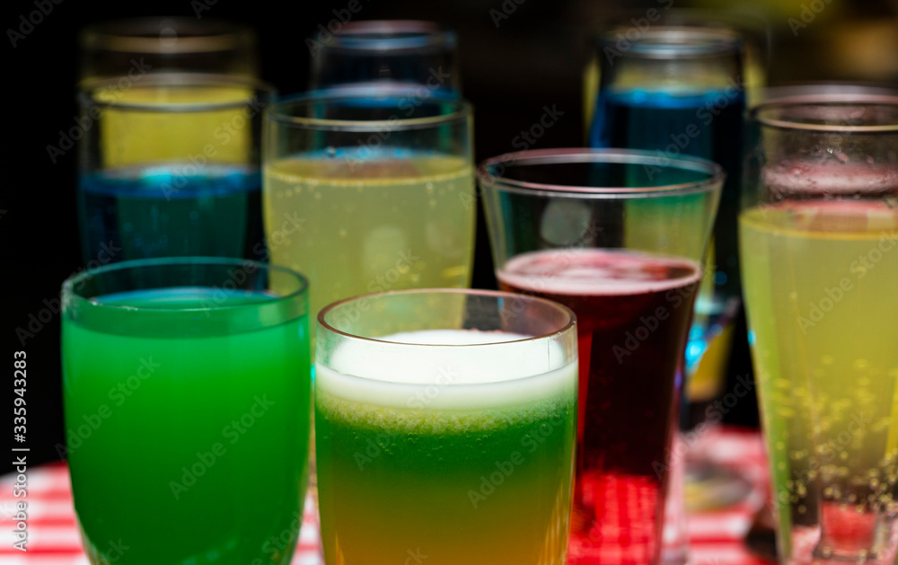 Glasses with a cocktail. Multicolored drinks. Drunk party. Glasses with a cocktail. Multicolored drinks. Drunk party.
