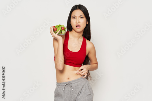 young woman holding a green apple © SHOTPRIME STUDIO