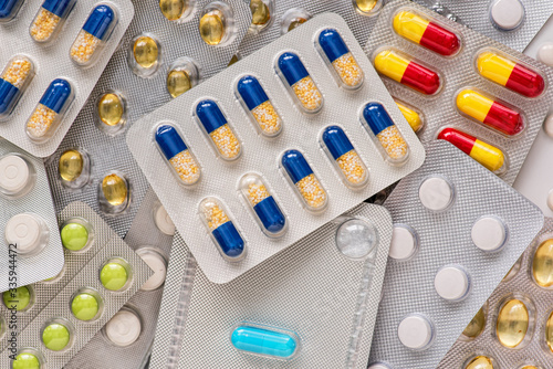 Selection of different pills in form of tablets and capsules. Drug prescription for treatment medication.
Pharmacy drugstore.