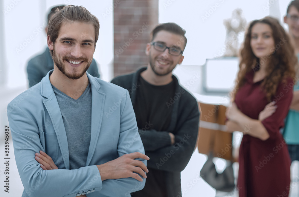 successful designer in the background of his team successful designer in the background of his team