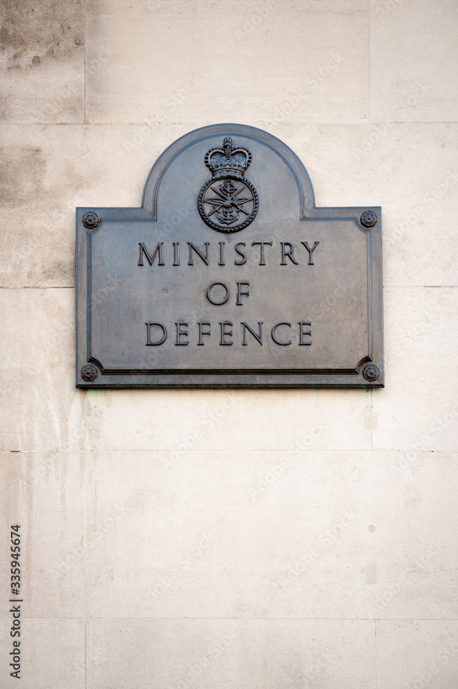 Fototapeta premium Old brass sign marking the offices of the British Ministry of Defence on a building in Whitehall, London, UK
