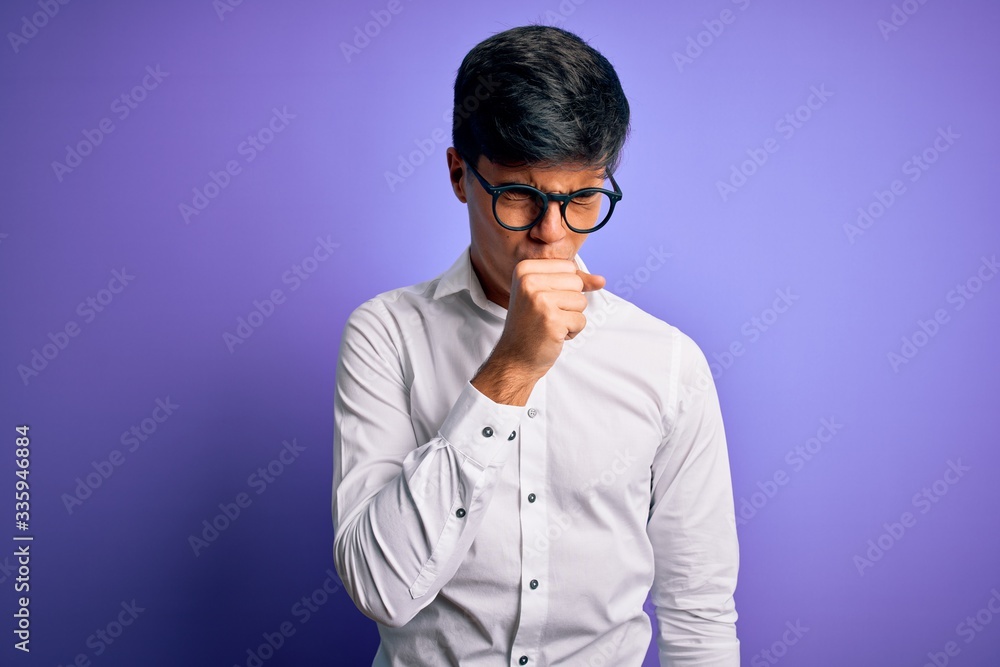 Young handsome business man wearing shirt and glasses over isolated purple background feeling unwell and coughing as symptom for cold or bronchitis. Health care concept. Young handsome business man wearing shirt and glasses over isolated purple background feeling unwell and coughing as symptom for cold or bronchitis. Health care concept.