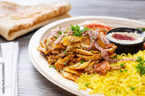 A view of a chicken shawarma plate, in a restaurant or kitchen setting.