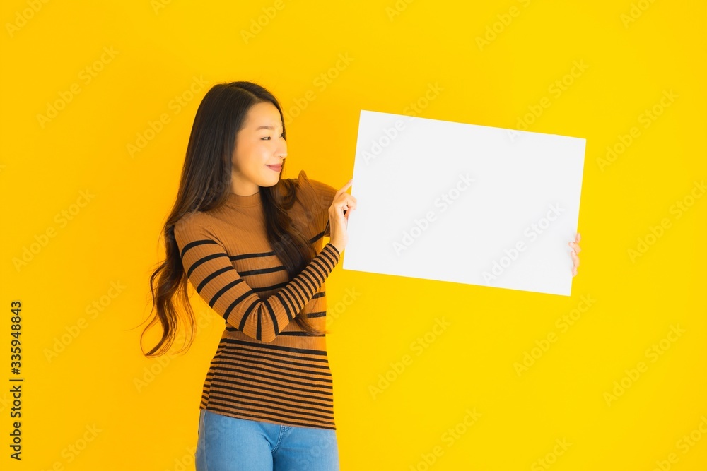 Portrait beautiful young asian woman with empty blank white card board for text Portrait beautiful young asian woman with empty blank white card board for text