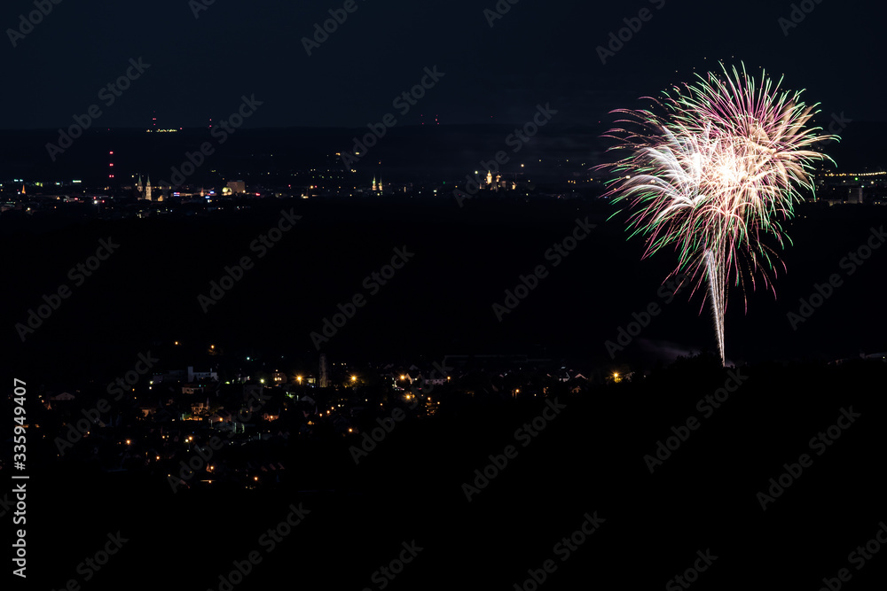 A firework above a city A firework above a city