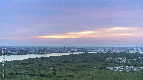 Timelaps of colorful sky sunset above city landscape view and chaophaya river with marine boats location at  Bangkok thailand photo