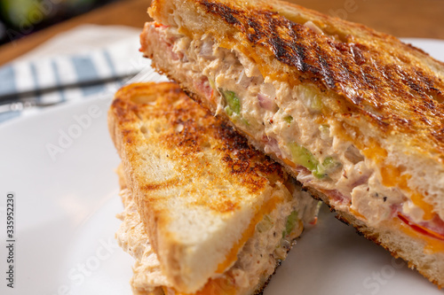 Wallpaper Mural A closeup view of a tuna melt sandwich, in a restaurant or kitchen setting. Torontodigital.ca