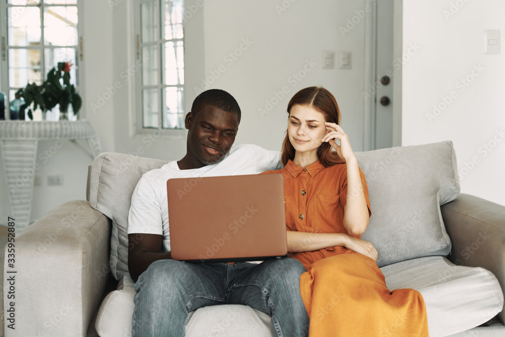 hispanic couple using laptop hispanic couple using laptop