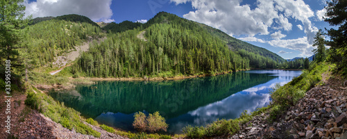 Beautiful forest lake in the Altai mountains, summer landscape