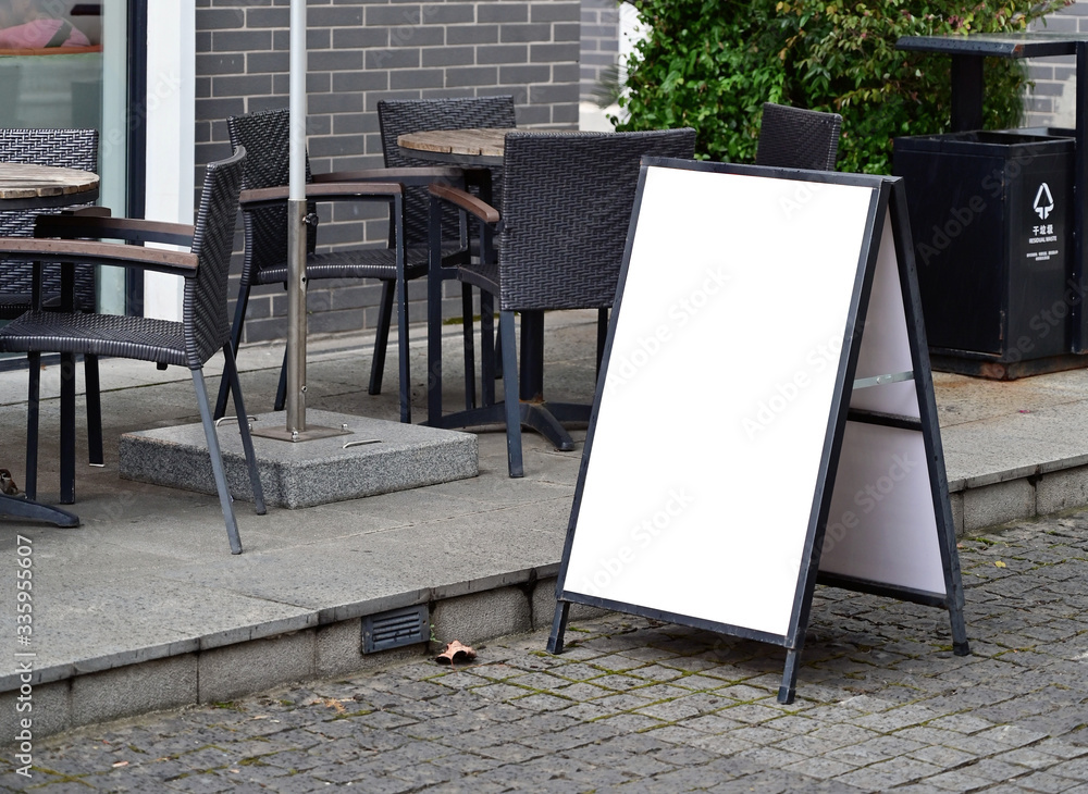 Blank poster stand for outdoor restaurant - obrazy, fototapety, plakaty 