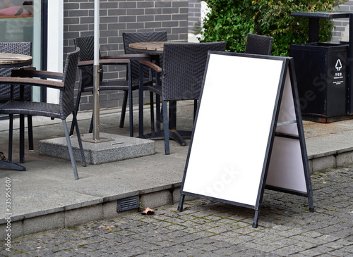 Blank poster stand for outdoor restaurant photo