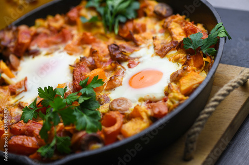 Spanish migas with pumpkin and meat