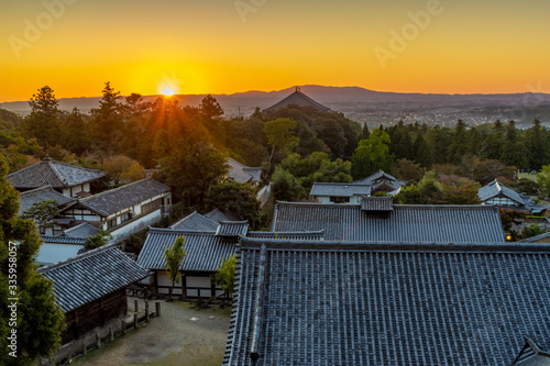 Sunset over the temples in Nara Park, Japan photo