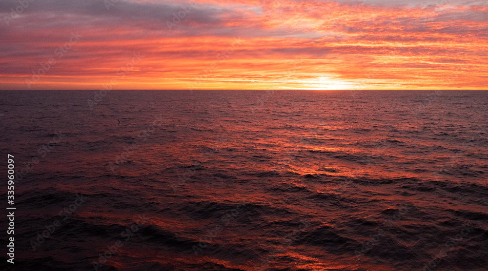 Beautiful red-coloured sunset observed from fishing vessel in the South Atlantic.