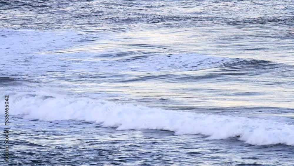 Calming waves moving in and out of the beach on a sunny day in the Oregon coast Calming waves moving in and out of the beach on a sunny day in the Oregon coast
