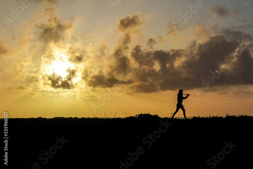 Photographer silouete walking at sunset