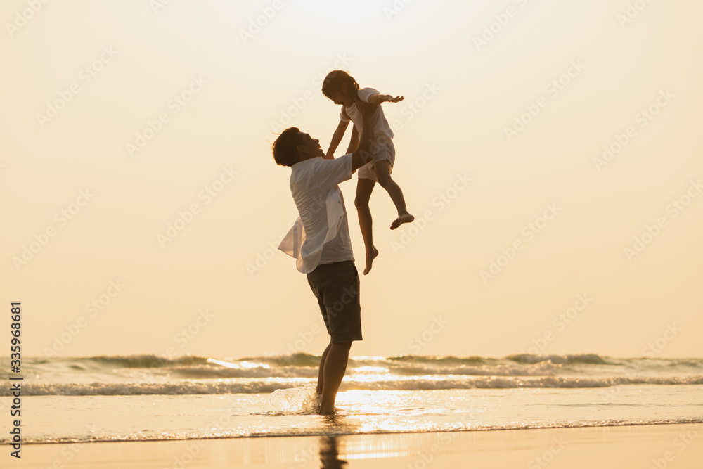 Fototapeta premium happy family enjoying on the beach at sunset