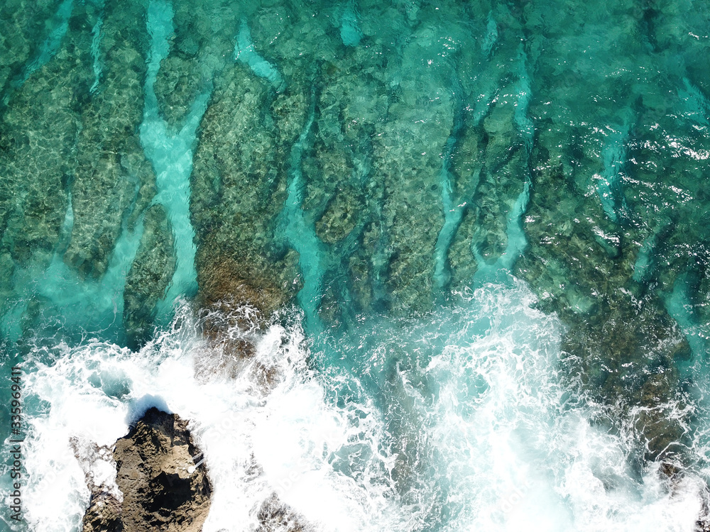 View from the bird-eye to the beautiful turquoise ocean and sandy beach, Caribbean sea, shot on a drone View from the bird-eye to the beautiful turquoise ocean and sandy beach, Caribbean sea, shot on a drone