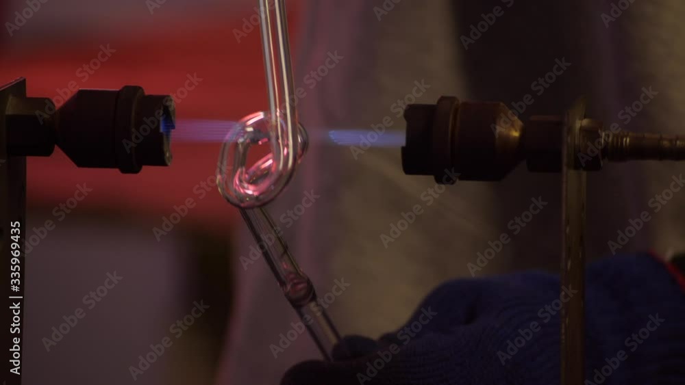 Making neon sign. Bending of a neon tube using a gas torch vídeo do Stock Adobe Stock