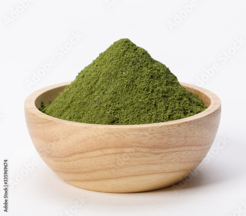 Matcha green tea powder in bowl isolated on white background, Organic product from the nature for healthy with traditional style
