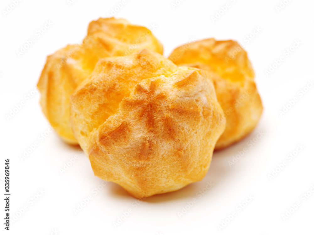 eclairs filled with fresh cream on white background eclairs filled with fresh cream on white background