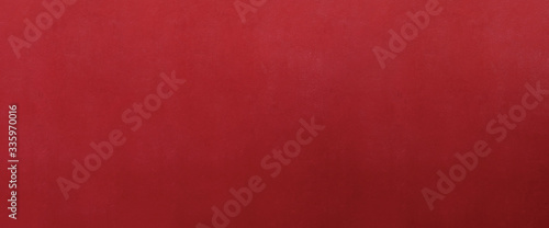 Red concrete stone surface paint wall background, Grunge cement paint texture backdrop, Red rough concrete stone wall background, Copy space for interior design background, banner, wallpaper