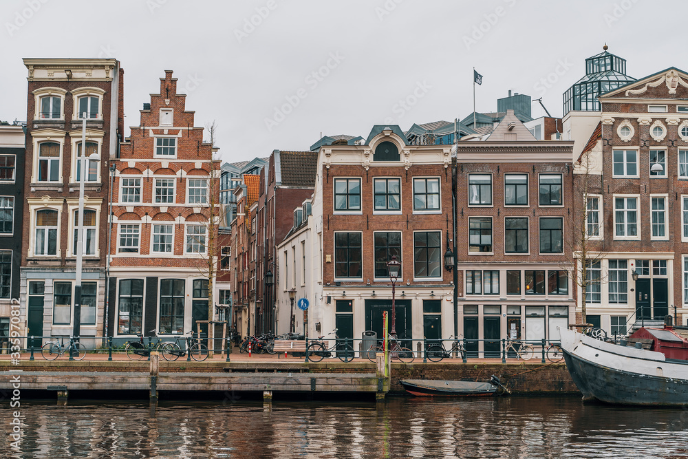 Typical famous dancing houses in Amsterdam landscape downtown, Netherlands.