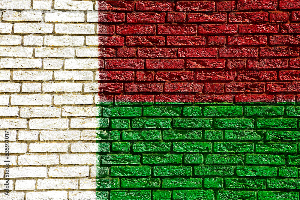 Colorful background and texture depiction of country flag on a brick wall. Colorful background and texture depiction of country flag on a brick wall.