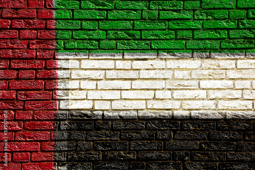 Colorful background and texture depiction of country flag on a brick wall. Colorful background and texture depiction of country flag on a brick wall.