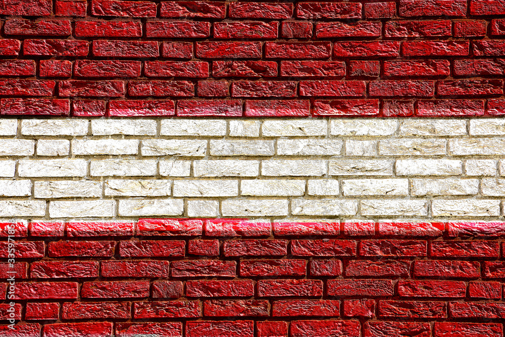 Colorful background and texture depiction of country flag on a brick wall. Colorful background and texture depiction of country flag on a brick wall.