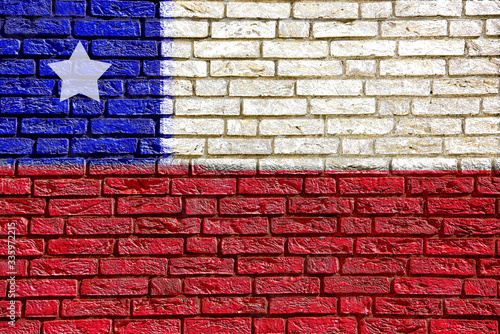 Colorful background and texture depiction of country flag on a brick wall.  photo