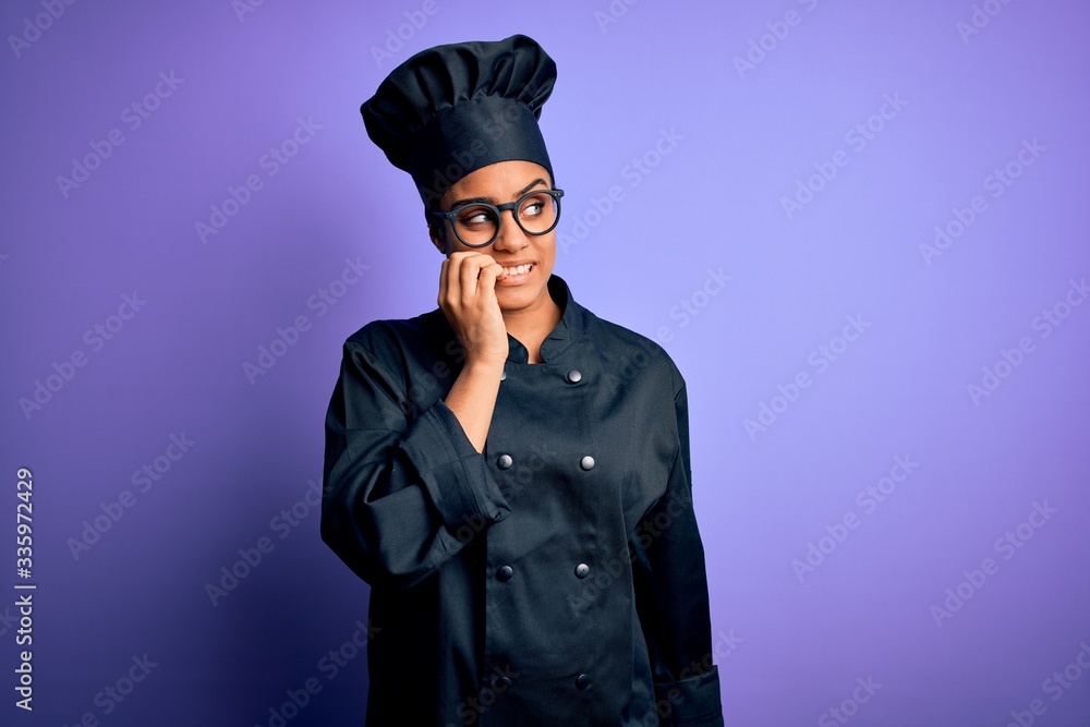 Young african american chef girl wearing cooker uniform and hat over purple background looking stressed and nervous with hands on mouth biting nails. Anxiety problem. Young african american chef girl wearing cooker uniform and hat over purple background looking stressed and nervous with hands on mouth biting nails. Anxiety problem.