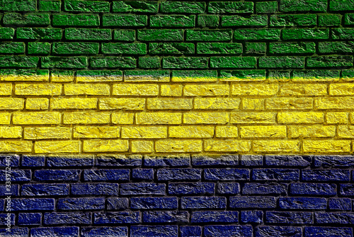 Colorful background and texture depiction of country flag on a brick wall. 