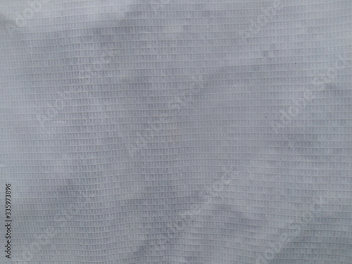 Crumpled fabric textured, close up view. Abstract background.
