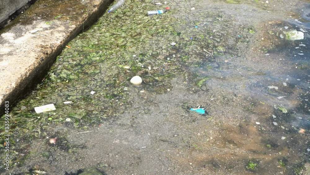 Plastic trash garbage in sea water. Human activity influence to wild life and natural environment, it is an ecological problem and urban seaside pollution. Plastic trash garbage in sea water. Human activity influence to wild life and natural environment, it is an ecological problem and urban seaside pollution.