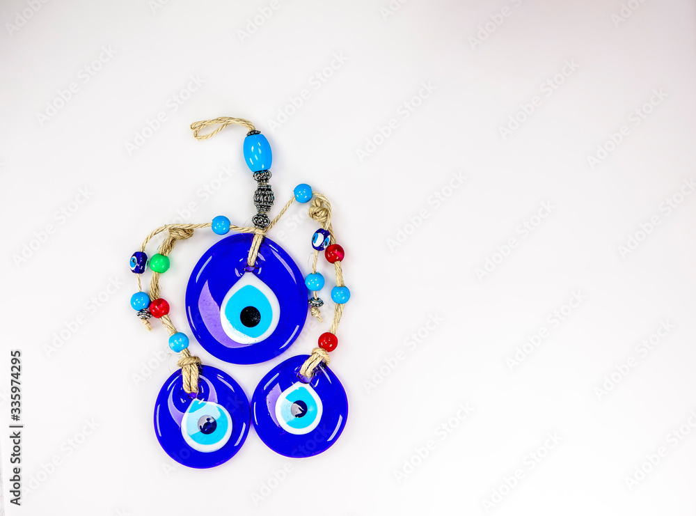 Pretty Turkish evil eye pendants isolated against a white background