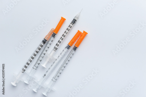 Syringe with a transparent vaccine isolated on white background