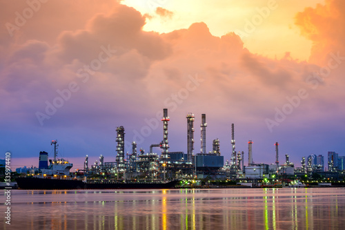 oil refinery industry plant in twilight with a reflection in the river. Bangkok Thailand.