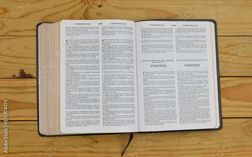 open bilingual bible book on the second letter of Paul to Timothy, Spanish and english 