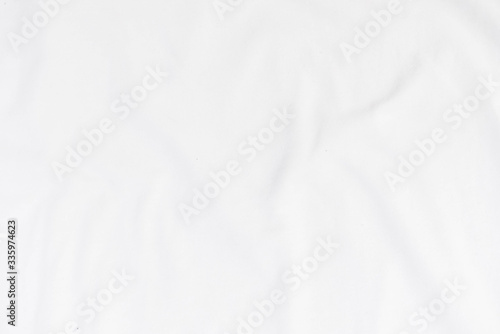 Abstract white fabric texture background. Wavy white cloth.