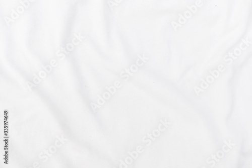 Abstract white fabric texture background. Wavy white cloth.