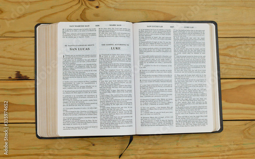 open bilingual bible book on Luke, Spanish and english 