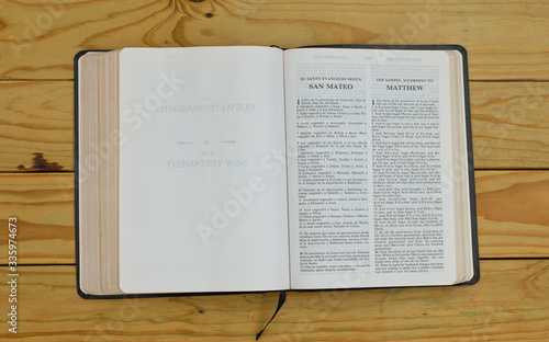 open bilingual bible book on Matthew, Spanish and english  photo