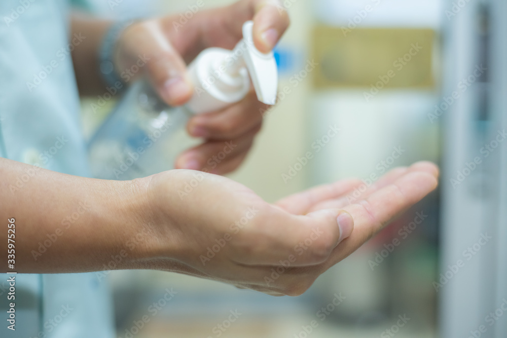 Hand using 70% alcohol gel with protected COVID-19 virus or coronavirus. Hand using 70% alcohol gel with protected COVID-19 virus or coronavirus.