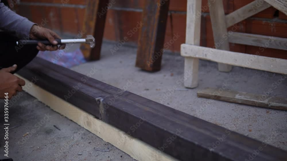 Welder welding metal in workshop with sparks Welder welding metal in workshop with sparks