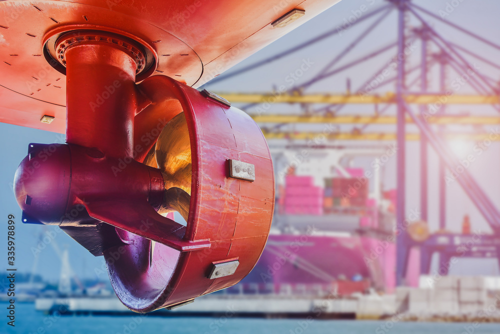 Red propeller in rope guard with rudder under Ship repairing in